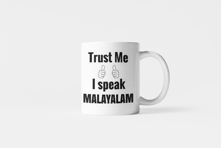 White Coffee Mug with "Trust Me, I Speak Malayalam" Print