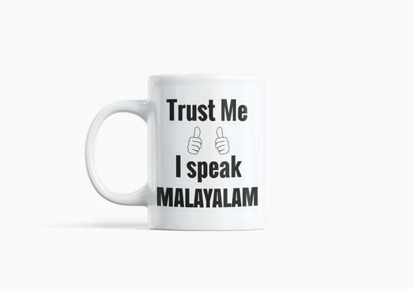 White Coffee Mug with "Trust Me, I Speak Malayalam" Print